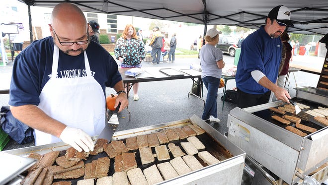 A volunteer cooks scrapple at a previous Apple Scrapple Festival