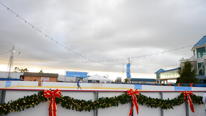 Victoria VanMeter, volunteer, tests out the "Visit Delaware Ice Rink" at the Winter Wonderfest Center located at the Cape May-Lewes Ferry Terminal and also in the Cape Henlopen State Park. That will run Nov. 17 to December 31, 2017.