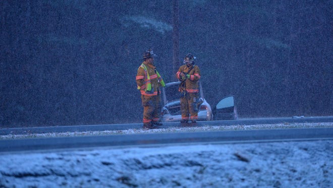 Emergency responders work at the scene of a crash on Business Route 50 near Queen Avenue in Salisbury on Friday evening.