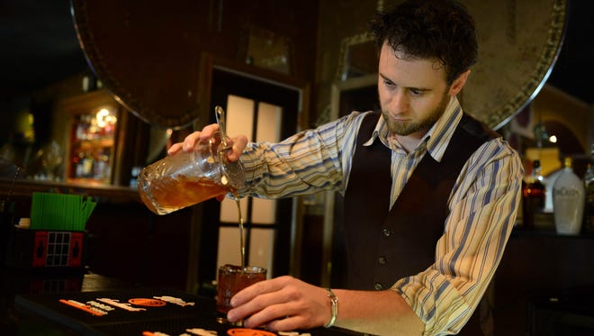 Ocean 13's Mixologist Tim Coiner Williams prepares a chai old fashioned at the new Whiskey Bar on Friday, May 18, 2018 in Ocean City, Md.