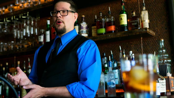 Bar owner, Tom Houser, makes an Old Smokey cocktail. A new bar has quietly opened in Greenville called the Copperhead Saloon which opened June 9, offering a variety of small plates and old-fashioned, historic cocktails.