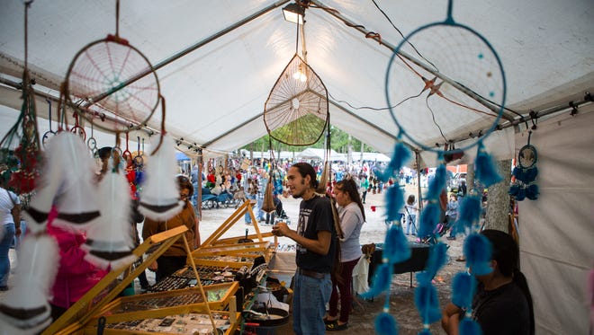 Artists and vendors sell Native American items during the 40th Nanticoke Powwow in Millsboro.