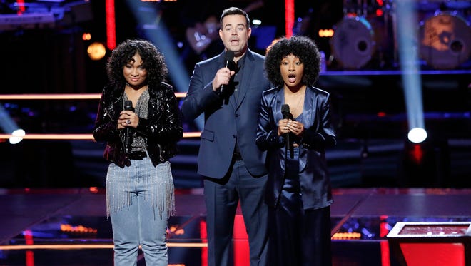 Newark native Kelsea Johnson (right) learns she has advanced to the next round of "The Voice"  during Tuesday night's episode. Host Carson Daly and fellow contestant Jordyn Simone look on.