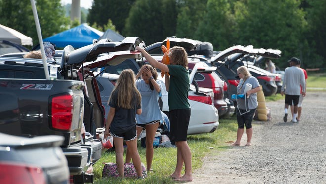 Campers arrive at the Firefly Music Festival in Dover.
