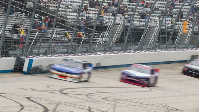 Race cars drive next to the newly added safety barrier on turn four at the Drive Sober 200 presented by the Delaware Office of Highway Safety NASCAR Xfinity Series race at Dover International Speedway in Dover, Del.