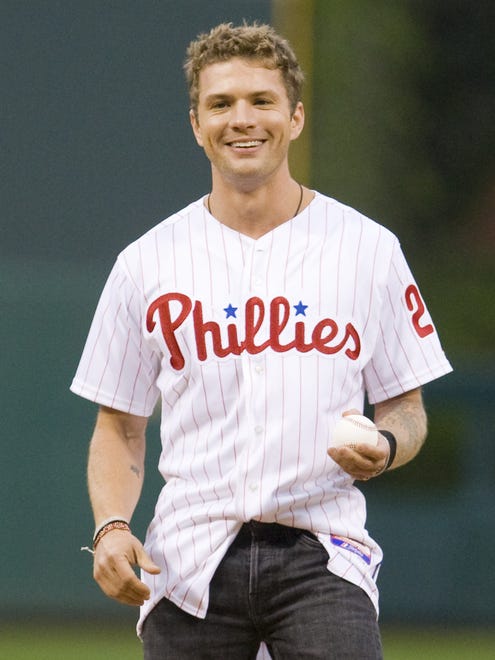 Delaware native Ryan Phillippe is a Philly sports fan, period. Here he gets ready to throw out the first pitch before a Phillies game in 2010, but he ' s been a vocal Eagles supporter, too.