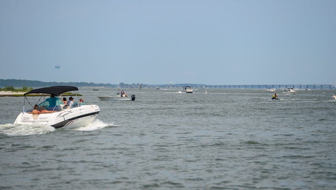 The Assawoman Bay is full of boaters and fisherman during the holiday week in Ocean City, Md. on July 3, 2017.