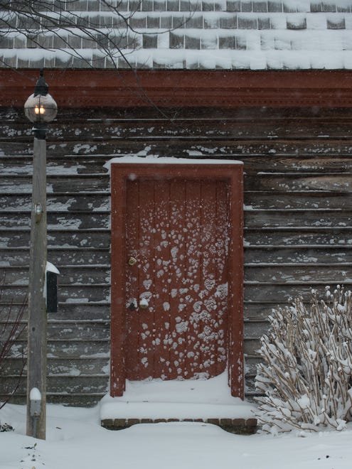 Snow covers a entry door at a historic home in downtown Lewes.