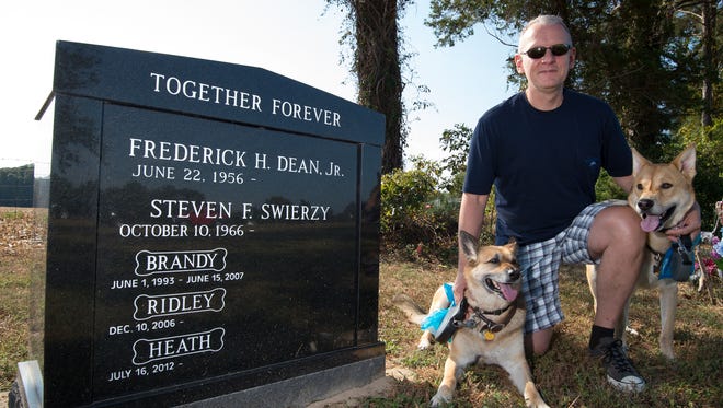 Steven Swierzy, with his dogs Heath (left) and Ridley, has a burial site at Henlopen Memorial Park in Milton for him and his husband, Frederick Dean Jr., as well as for their pets. Many states expressly bar burying pets in human cemeteries, but Delaware law is silent on the matter.