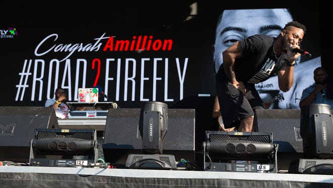 Amillion The Poet, a Dover native, performs on the Backyard Stage at the Firefly Music Festival in Dover.