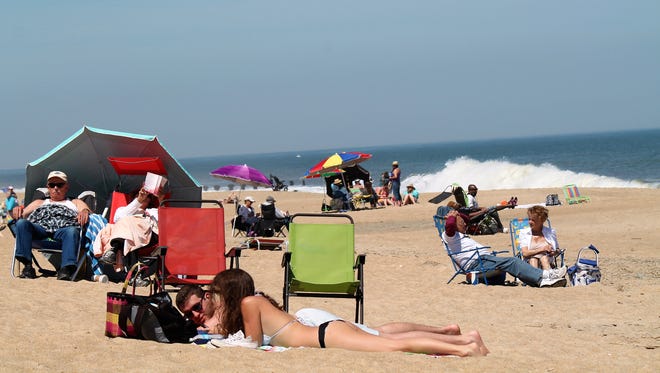 People flock to Rehoboth Beach on the first 80-degree this spring. Rehoboth has been nominated by "USA Today" Readers as one of the best coastal small towns in America.