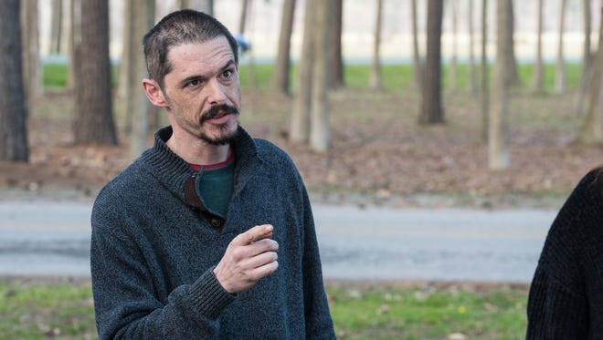 K.T. Tuminello speaks about his experience as a cancer patient during a protest at Maryland State Police Barrack V in Berlin on Wednesday, April 11, 2018.