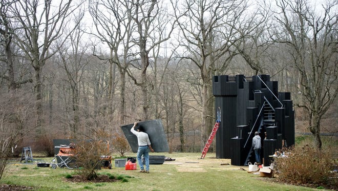 Last minute construction of the Gothic Tower Folly that will be on display at Winterthur Museum's garden follies exhibit.