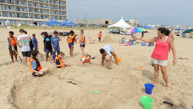 Students from the Mariner Middle School near Milton got together to make a viking as The 38th Annual Rehoboth Beach-Dewey Beach Chamber of Commerce Sandcastle Contest was held on Saturday, Sept. 10, 2016 at a new location on the south end of the beach near Funland under hot weather conditions.  Participants worked to create different castles and sculptures in the sand for judging in the late afternoon at which time trophy's ail be given out.
