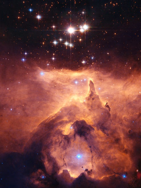 This image made by the NASA/ESA Hubble Space Telescope shows the star cluster Pismis 24 in the core of the large emission nebula NGC 6357. Part of the nebula is ionised by the youngest (bluest) heavy stars emitting intense ultraviolet radiation, heating the gas surrounding the cluster and creating a bubble in NGC 6357. The Hubble Space Telescope marks its 25th anniversary. A full decade in the making, Hubble rocketed into orbit on April 24, 1990, aboard space shuttle Discovery. (NASA/ ESA, Jesus Maiz Apellaniz - Instituto de Astrofisica de AndalucÌa, Spain via AP) ORG XMIT: NY931