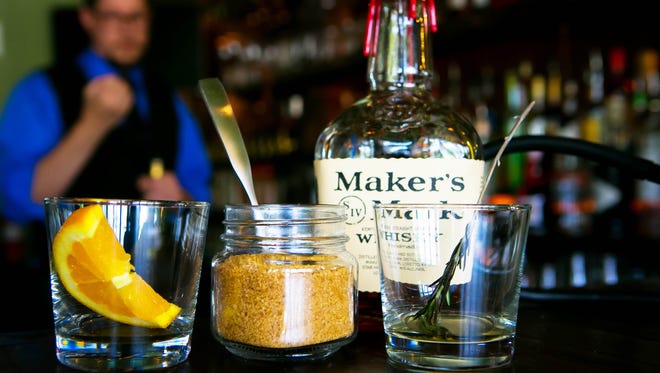 Bar owner, Tom Houser, makes an Old Smokey cocktail. A new bar has quietly opened in Greenville called the Copperhead Saloon which opened June 9, offering a variety of small plates and old-fashioned, historic cocktails.
