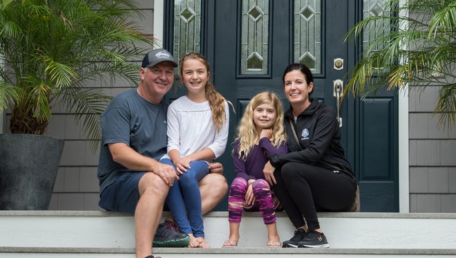 Steve Montgomery with wife Dee and kids pose for a photo at their home in Rehoboth Beach.