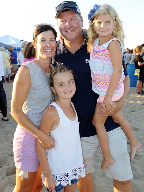 Steve Montgomery with wife Dee and kids pose for a photo as great weather brought out a large crowd to the Dewey Beach Business Partnership Beach Party.
Special to the News Journal / CHUCK SNYDER
