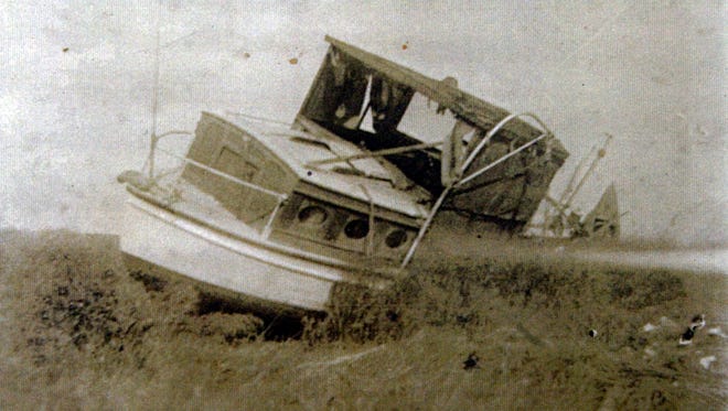 Left grounded after the tide subsided from the August storm of 1933, this luxury boat was found on Hoopers Island by the photographer. Other boats from the community were found miles away.