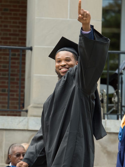 Francis Lamar Jackson Jr., celebrates after receiving his degree at the Wesley College Spring Commencement in Dover.  A total of 244 graduated.