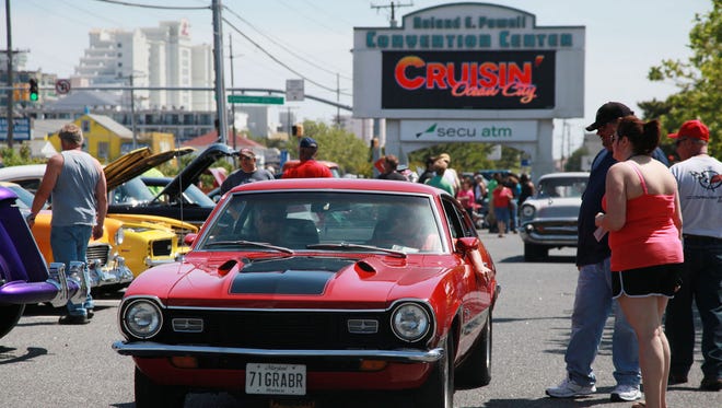 Classic and custom cars and trucks search for parking outside the Ocean City convention center during last year's Cruisin' Ocean City car show.