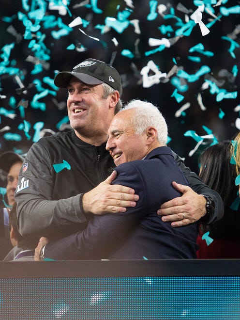 Eagles owner Jeffrey Lurie and head coach Doug Pederson celebrate winning Super Bowl LII Sunday at US Bank Stadium.