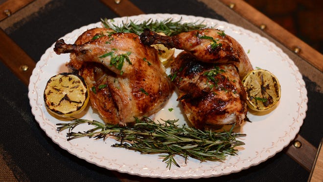 An Our Harvest feast that is an Arnold Palmer brined whole Giannone chicken off the rotisserie and wood oven charred with lemon and rosemary. Monday, May 22, 2017.
