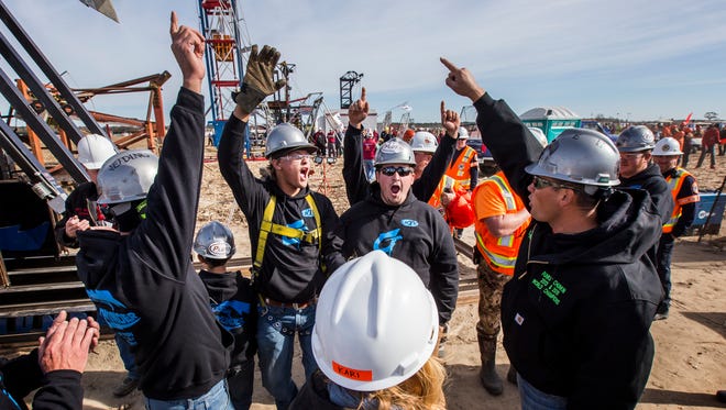 Members of Colossal Thunder celebrate after hearing the distance on their final launch of the 2016 World Championship Punkin Chunkin competition at Wheatley Farms in Bridgeville. Colossal Thunder won the trebuchet division, unseating defending champion Yankee Siege.