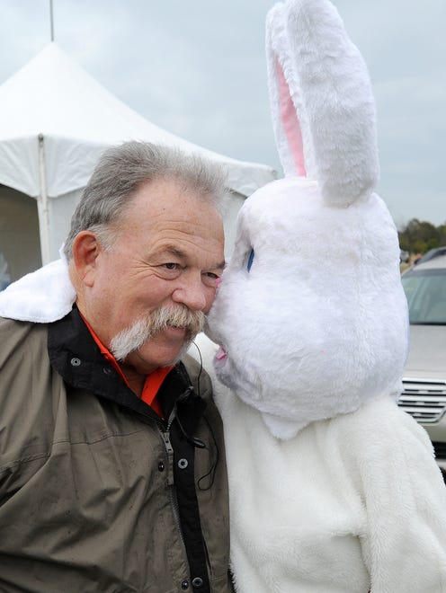 Frank Shade from Lewes one of the festival organizers gets a nose rub from the Easter Bunny as Despite cloudy and rainy weather, the 48th Annual Kite Festival was held on Friday March 25th at Cape Henlopen State Park near Lewes with a good crowd on hand flying all kinds of kites and creations.