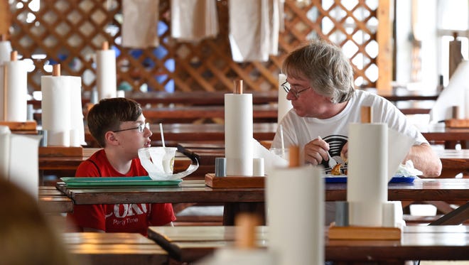 2015: Frank Burns and his nephew Sean eat lunch at the Grange. See more vintage images of the Delaware State Fair.