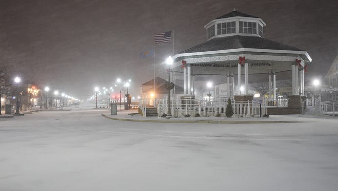 Snow started falling at Rehoboth Beach around 5:15 a.m.Saturday covering the boardwalk and roads with winds blowing about 20 mph out of the northeast.   Forecasts are for up to 6-8 inches with possible white out conditions as the snow increases.