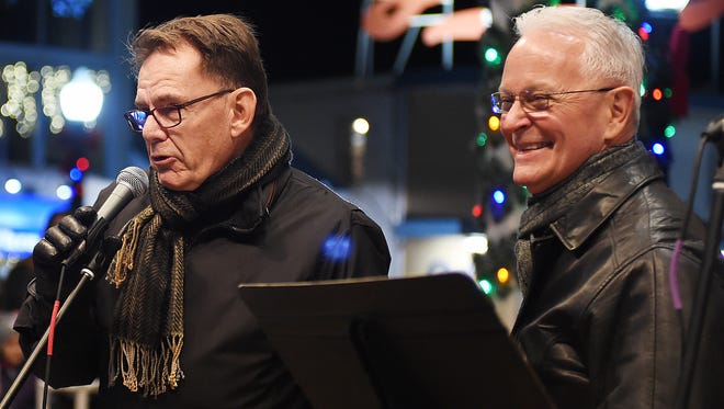 Bill Graff and Jeff Schuck, who donated the tree, lead the crowd in a countdown to the lighting at Rehoboth Beach's annual Christmas tree lighting ceremony on Friday, Nov. 24, 2017.