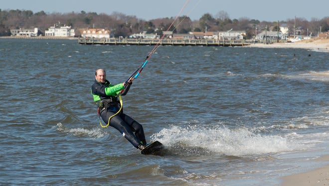 Sean Colgan of Rehoboth, owner of Got Wind? kiteboarding school, enjoys a afternoon of kiteboarding in the Rehoboth Bay south of Dewey Beach.