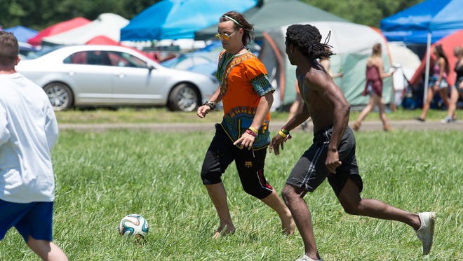 Lorenzo Rolocut of Somers, Conn., plays soccer on a field that the Firefly Music Festival set up in the north camping area, a request that festival goers ask for this year.