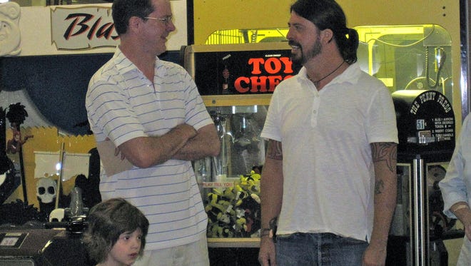 Tom Rogers, of Newark, talks with Dave Grohl at Funland on the Boardwalk in 2010.