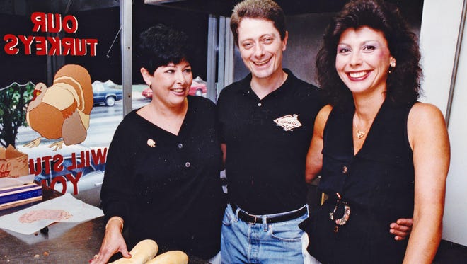 Capriott's founder Lois Margolet, left, with her brother Alan and Diane Brindle at the Capriotti's on Union Street in Wilmington in 1992. Margolet died from lung cancer at her home in Las Vegas on Thursday.