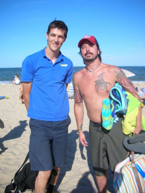 News Journal reader Andrei Labai submitted this photo in 2007 of him with Dave Grohl on the beach in Rehoboth. Labai said, "I told him that I had to buy tickets on Ebay for his sold out acoustic show in Philly and paid triple the price. He smiled and said that the show would be three time better then."