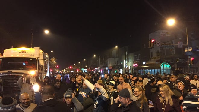 Eagles fans pour out into the streets to celebrate their team's first Super Bowl win.