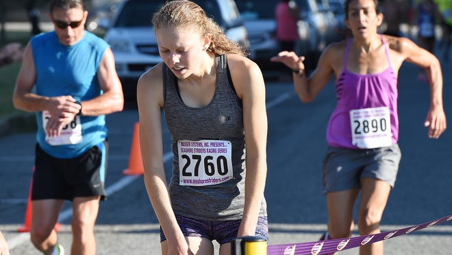 1st woman to cross the finish was Emily Young from Camillus, NY as Over 300 runners and walkers turned out for the 19th Annual Run for J.J. 5K & 5K Walk held on Sunday July 24th in downtown Rehoboth Beach.