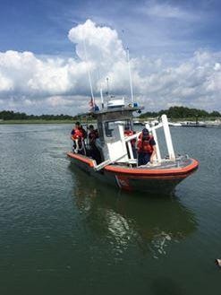A crew from the U.S. Coast Guard Station Indian River Inlet on Monday retrieves one of the lifeguard stands discovered stolen Thursday in Rehoboth Beach.
