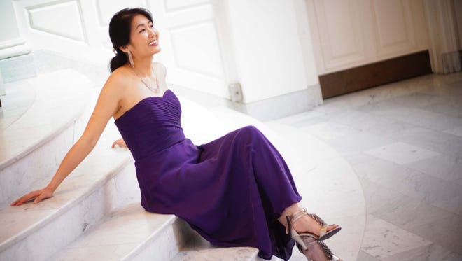 Pianist Hiroko Yamazaki wears a purple strapless silk Ralph Lauren dress she bought on eBay and silver Aerosoles sandals she bought because she likes the tassel detail.