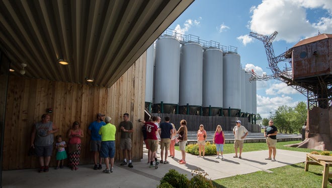 Visitors to Dogfish Head Brewery in Milton wait in line for them to open for tours and tastings.