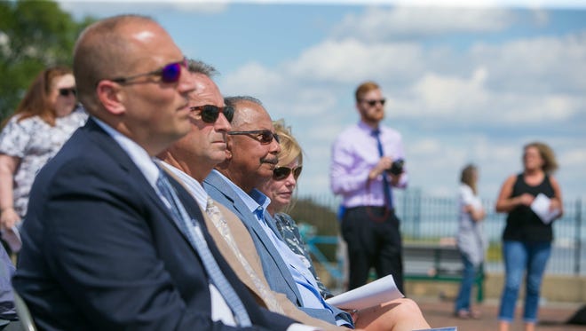 Guests attend the ribbon cutting ceremony for the grand opening of the pier in Old New Castle at Battery Park which replaces the one destroyed by Superstorm Sandy back in 2012.