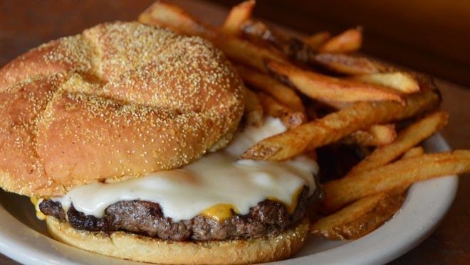 The cheddar and Swiss cheeseburger pictured March 3 at Back Street Grill. The Salisbury restaurant's burgers are served with hand-cut fries.