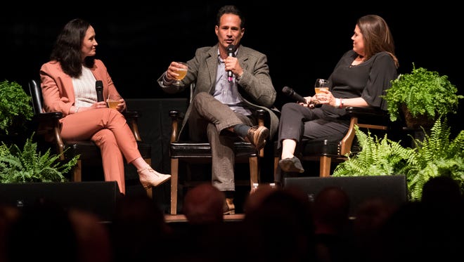 Karissa Thacker, left, speaks with Dogfish Head Craft Brewery Inc. founders Sam Calagione, center, and Mariah Calagione during the 2018 Delaware History Makers Award & Celebration Thursday night in Wilmington.