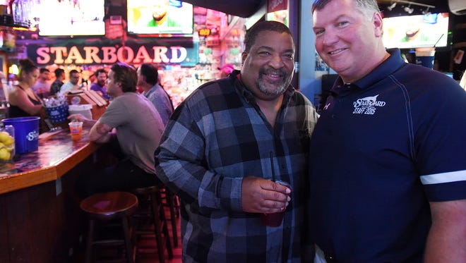 Steve "Monty" Montgomery co-owner of the Starboard in Dewey Beach  with DJ "Smokey" works the bar and crowd at his establishment along Coastal Highway and Saulsbury Street.
Special to the News Journal / CHUCK SNYDER