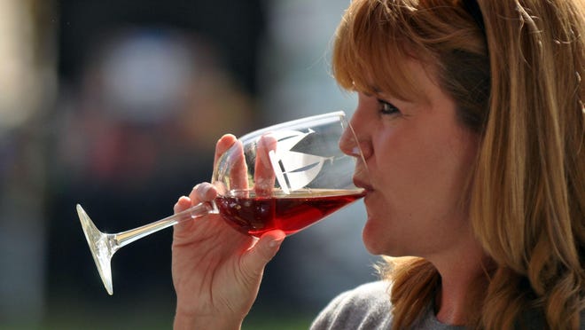 A woman samples wine during a previous Autumn Wine Festival at Pemberton Historical Park in Salisbury.