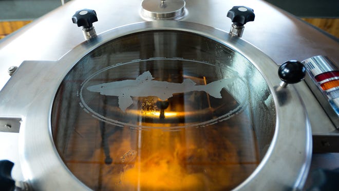 A mash mix goes through one of the Dogfish Head tanks at the Dogfish Head Brewery located in Milton, Del. on Friday, July 14, 2017.