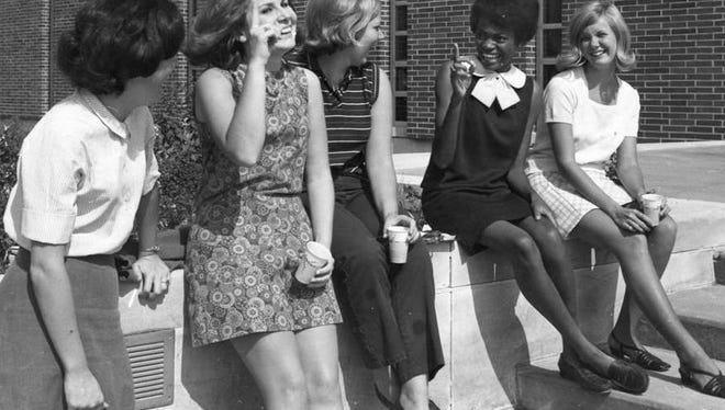 1970: Several SU students take a moment to relax on campus.