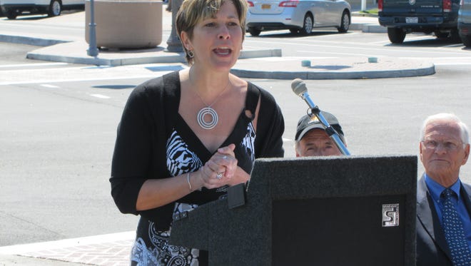 Bethany-Fenwick Area Chamber of Commerce Executive Director Kristie Maravalli delivers remarks during a ribbon cutting of the Bethany Beach Streetscape project Friday, May 22 in downtown Bethany Beach.